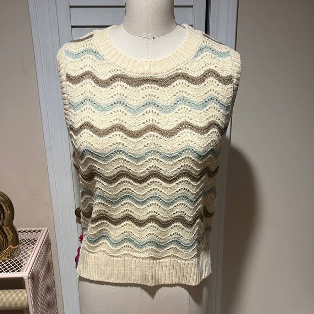 Sleeveless sweater top in ivory, green and brown wave pattern.